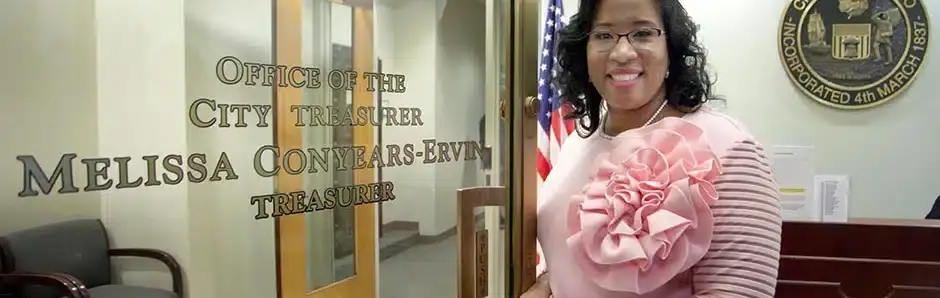 City Treasurer's Office with woman standing beside the door, Chicago emblem visible