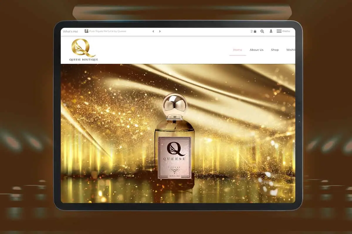 Queens Scent perfume bottle on a gold backdrop