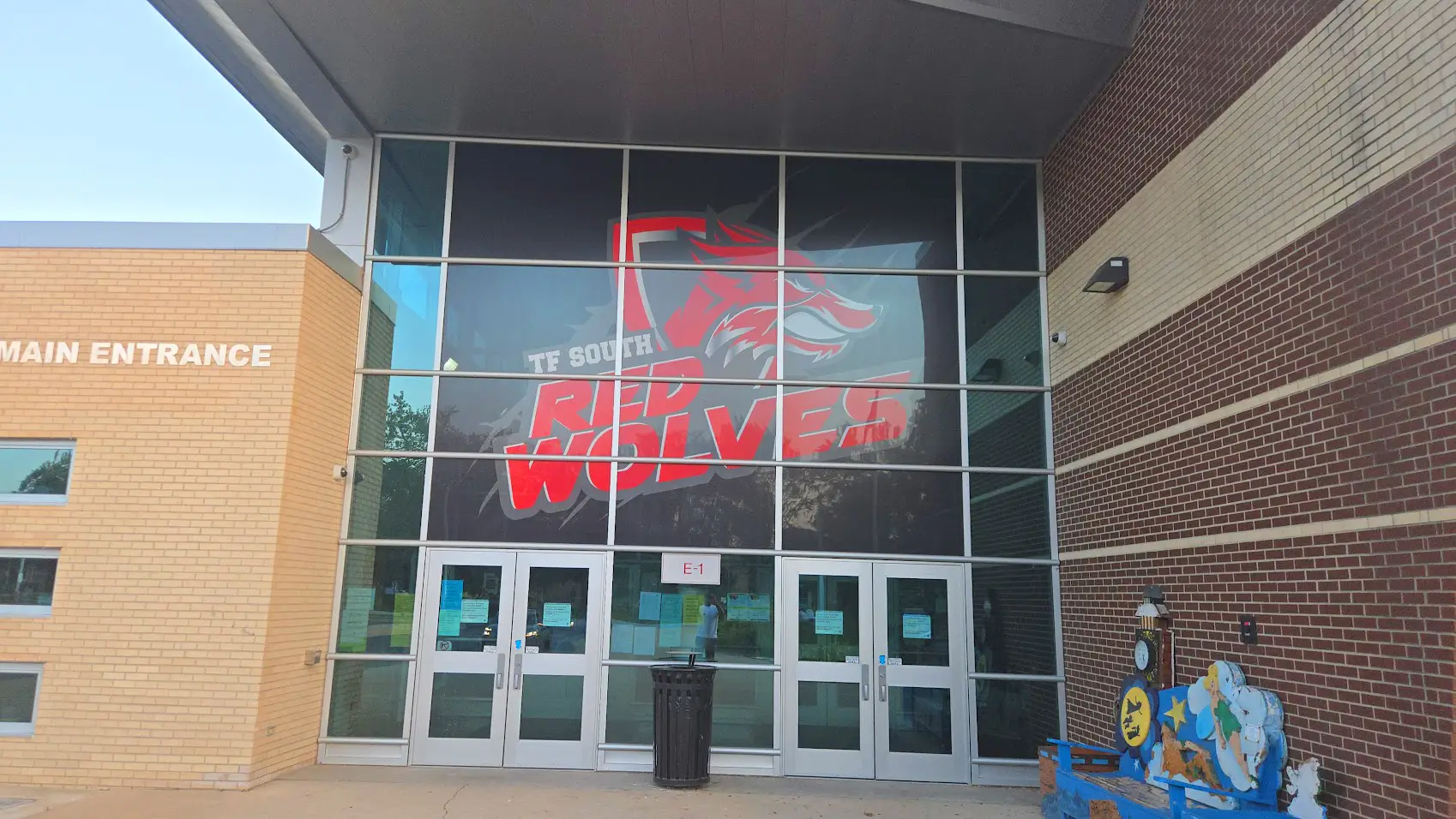 Entrance of TF South High School featuring Red Wolves logo