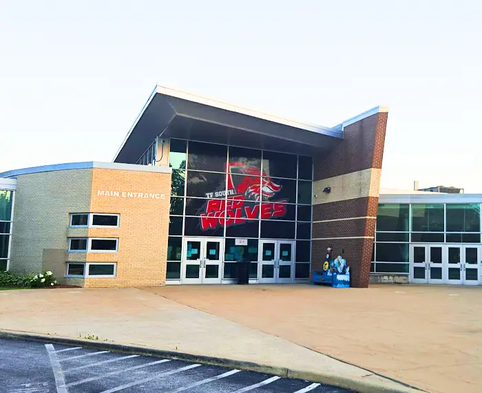 TF South High School main entrance with Red Wolves logo