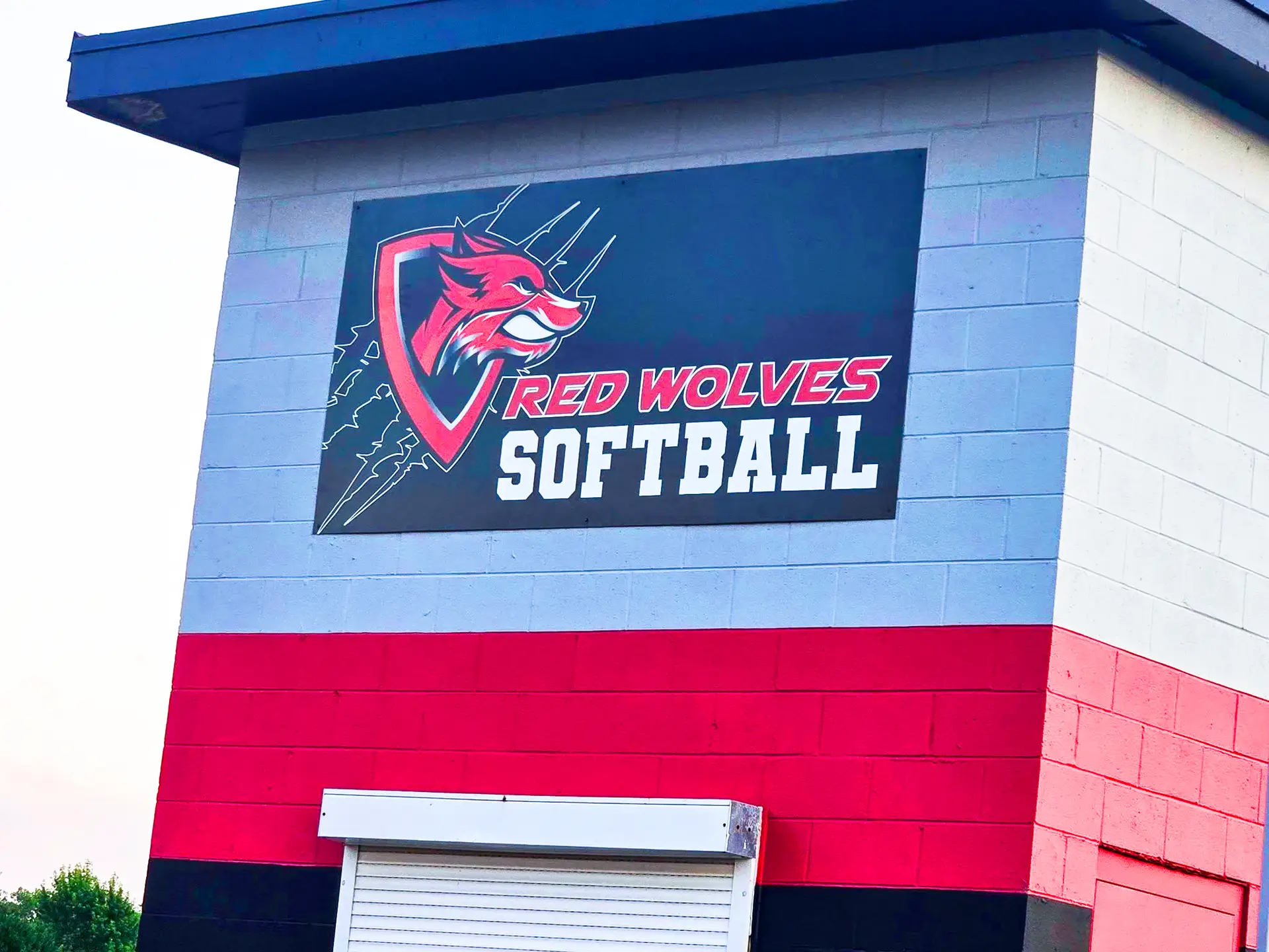 Red Wolves Softball team logo on a colorful building wall