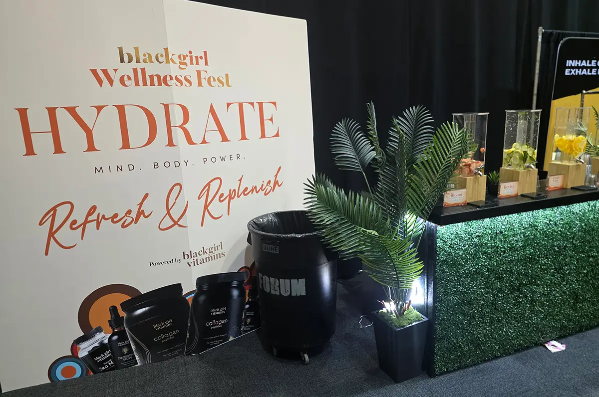 Black Girl Wellness Fest hydration station with vitamins and plant displays