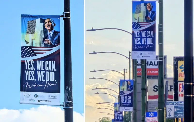 Street banners with 'Yes, We Can. Yes, We Did. Welcome Home!' message